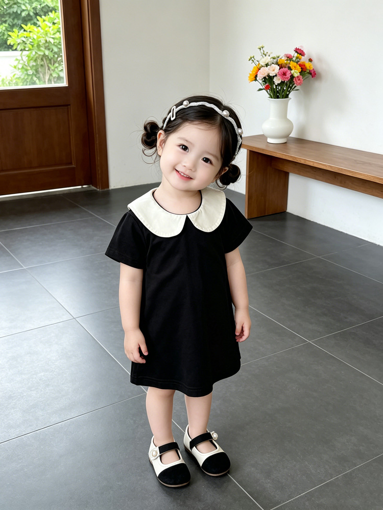 Bebé de verano vestido de estilo Hepburn bebé negro y blanco contraste muñeca cuello de manga corta A vestido de moda ropa infantil