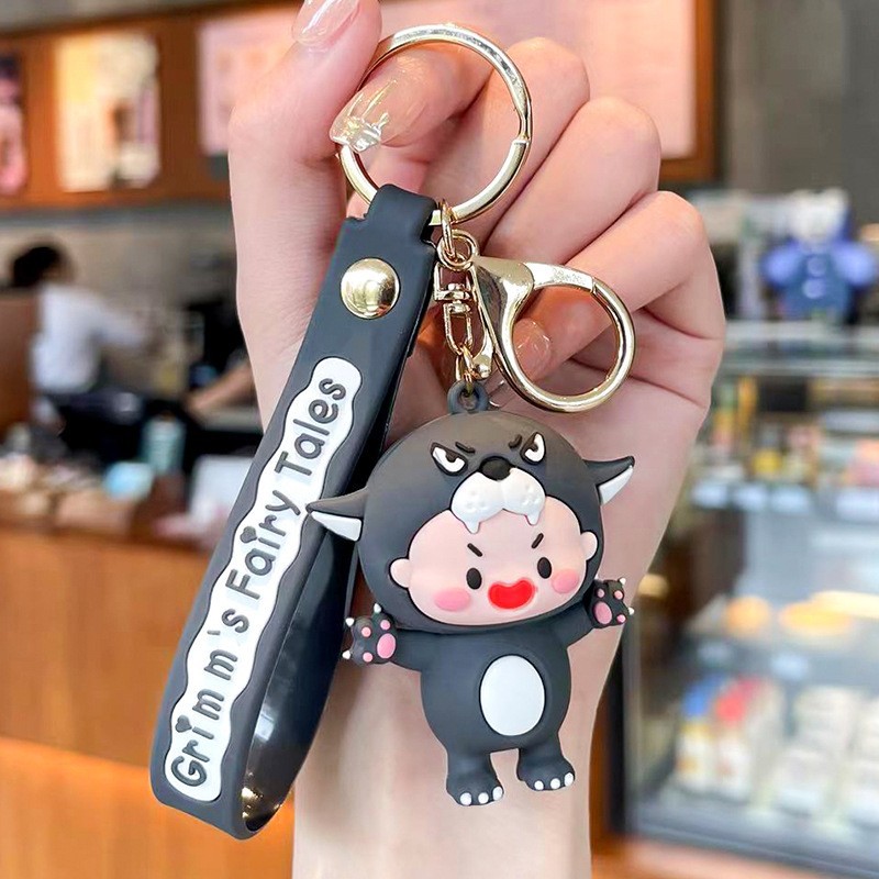 Muñeca de goma goteando bolsas escolares colgantes colgantes de muñecas colgantes de la máquina del mercado nocturno regalos al por mayor llaveros de dibujos animados