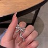 Wedding ring with bow, diamond encrusted, Japanese and Korean, on index finger