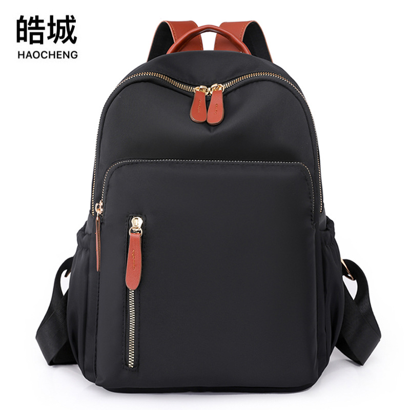 2023 nueva mochila casual para mujer de nailon moda salvaje viaje urbano mochila pequeña mochila escolar ligera al por mayor