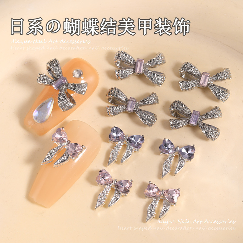 ネットの赤い合金の蝶結びのネイルアクセサリーの高級な金属の立体の蝶ネクタイの爪の装飾の部品の卸売り|undefined