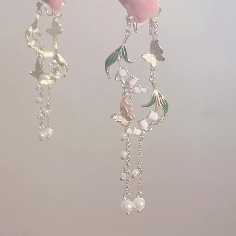 Asymmetrical design long ear clips with tassels