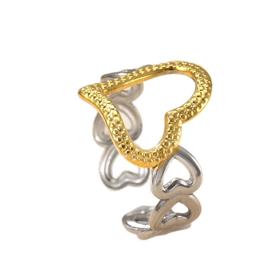 Venta caliente transfronteriza anillo de acero inoxidable diseño de nicho femenino anillo abierto a juego de colores aceite hueco amor fábrica de anillos de acero de titanio