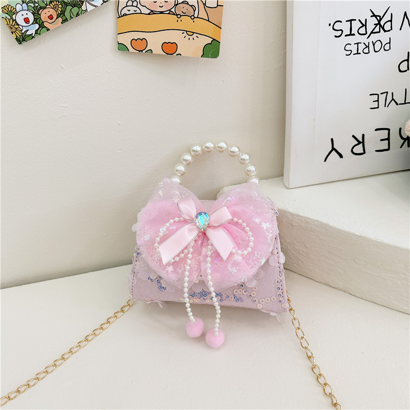Nueva princesa de dibujos animados bolsos infantiles lindos bolsos de arco de moda chica perla bolsos de hombro