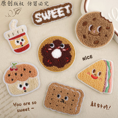 コンピュータ刺繍の刺繍はタオルを貼ってオリジナルの食品を刺繍します。