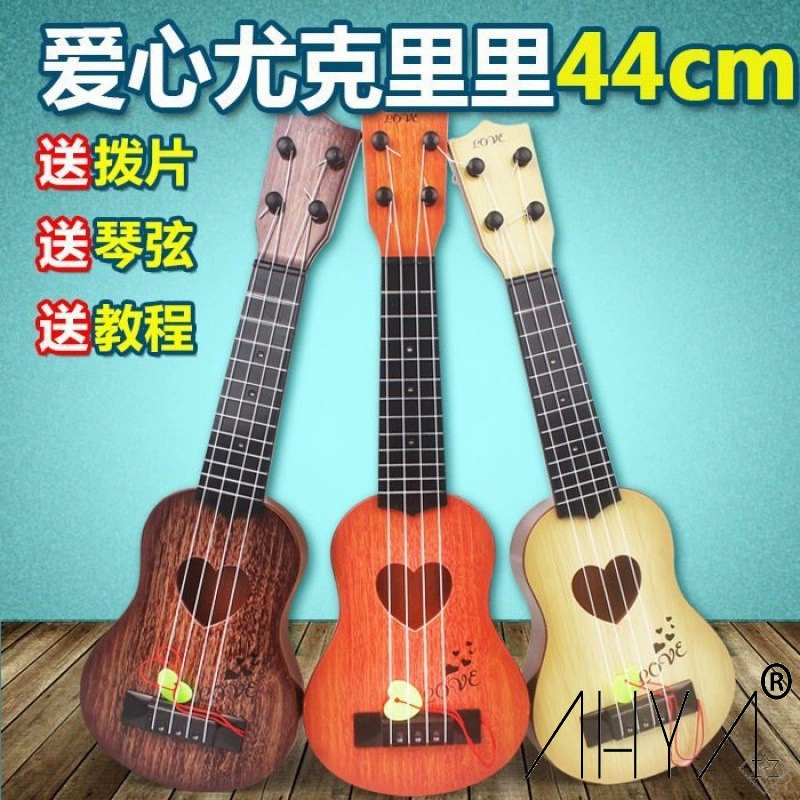 Ukulele with a score, guitar for beginners