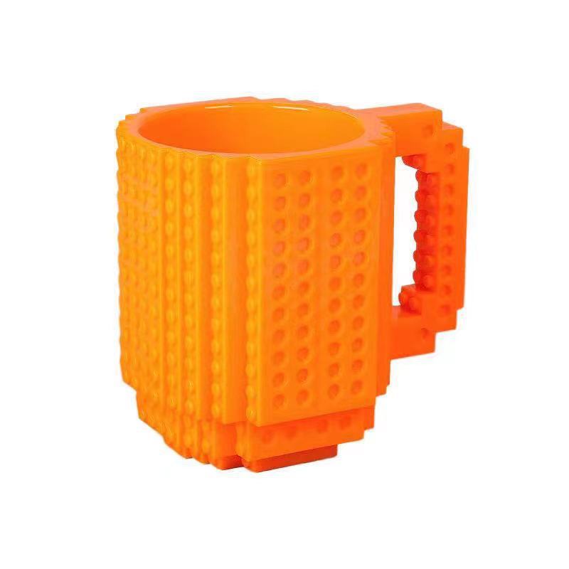 Fábrica al por mayor personalizado creativo Asamblea taza de agua educativa taza de té resistente a la gota taza de té Lego bloque de construcción