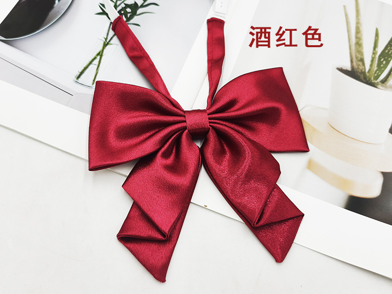 Spot al por mayor color sólido superficie brillante vino negro cuello rojo flor femenino estilo universitario nuevo estilo cola de golondrina plegable pajarita de raíz de pluma grande