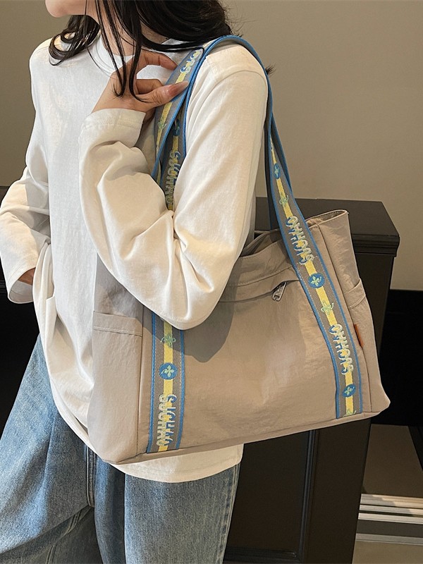 Bolso Tote portátil horizontal de tela de nailon para mujer 2025 nueva moda casual todo fósforo bolso de hombro de trabajo