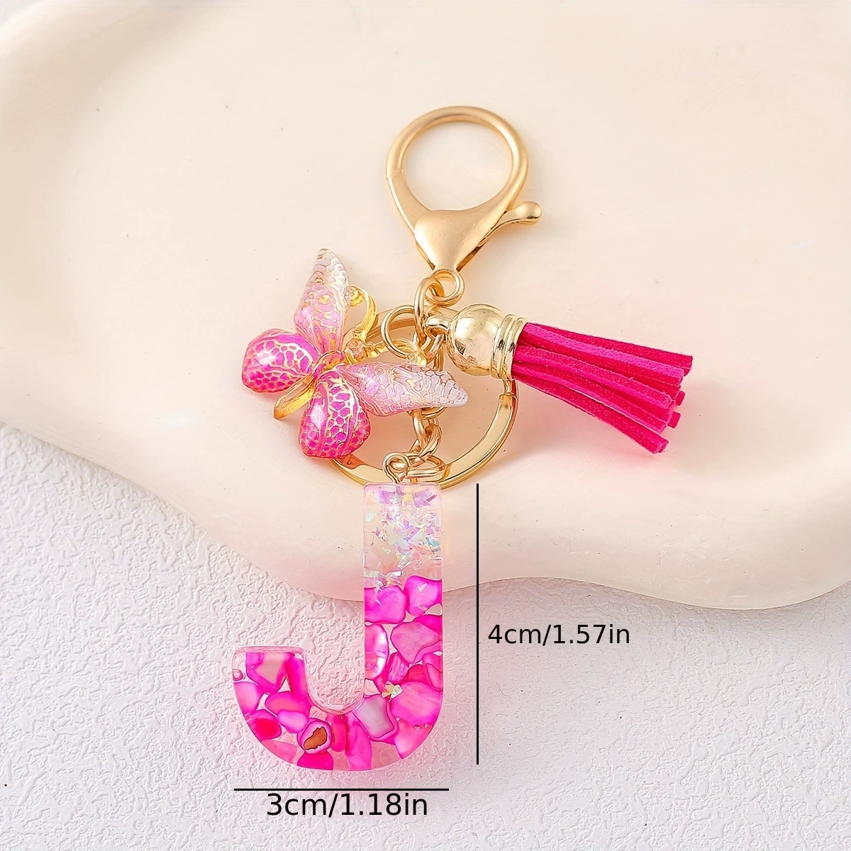 Pink golden keychain with tassels, gradient, with gem