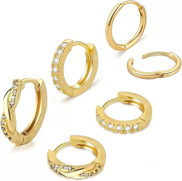 Three pairs of gold set with diamonds