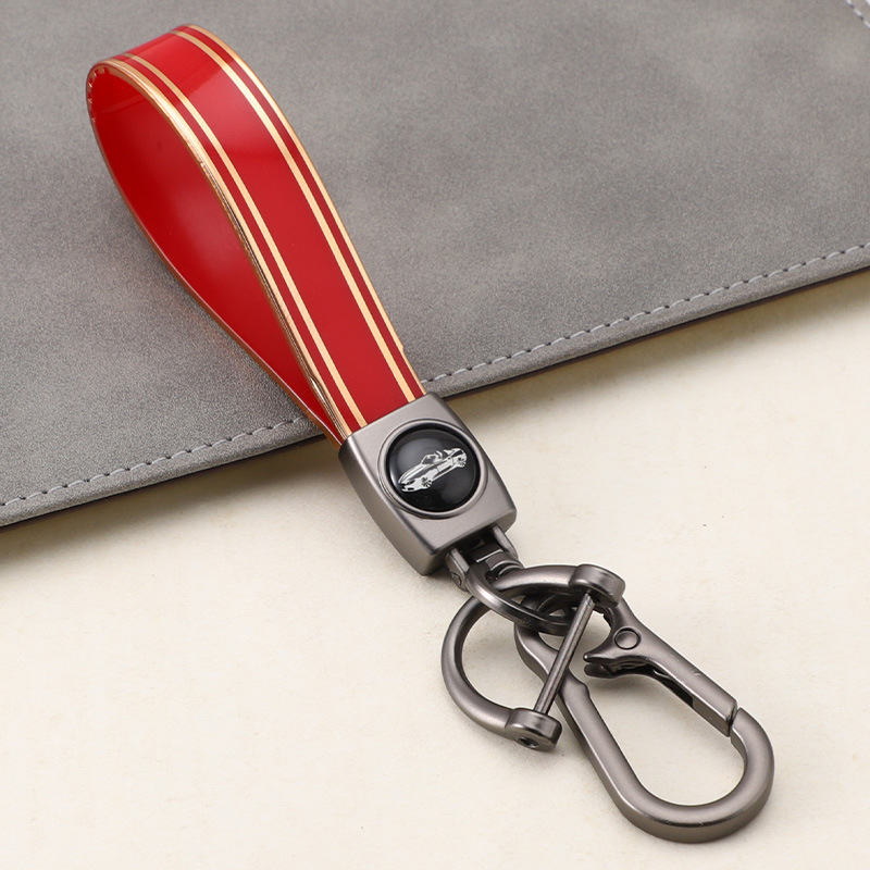 Cuerda de mano de silicona transfronteriza llavero de coche logotipo de coche apellido llavero anti-pérdida llavero de cuerda de mano de silicona duradera