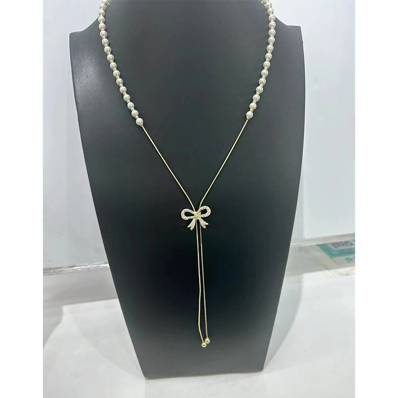 Collier de perles à tirer pour femme, chaîne ras du cou à pompon papillon haut de gamme et polyvalente, chaîne tendance unique pour pull_voghion.com