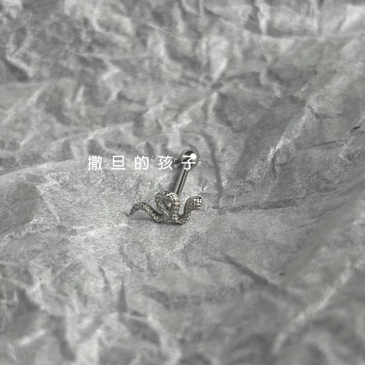 Silver pointed spike labret stud material detail
