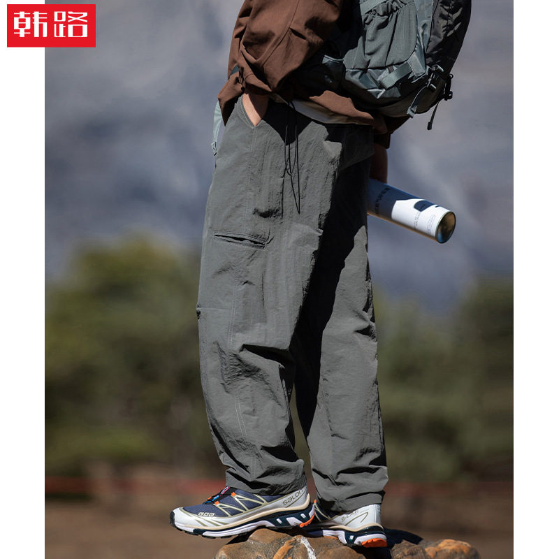 Pantalones casuales rectos al aire libre de montaña primavera para hombres nuevo estilo japonés diseño de cinturón de hebilla suelta pantalones de viento funcionales