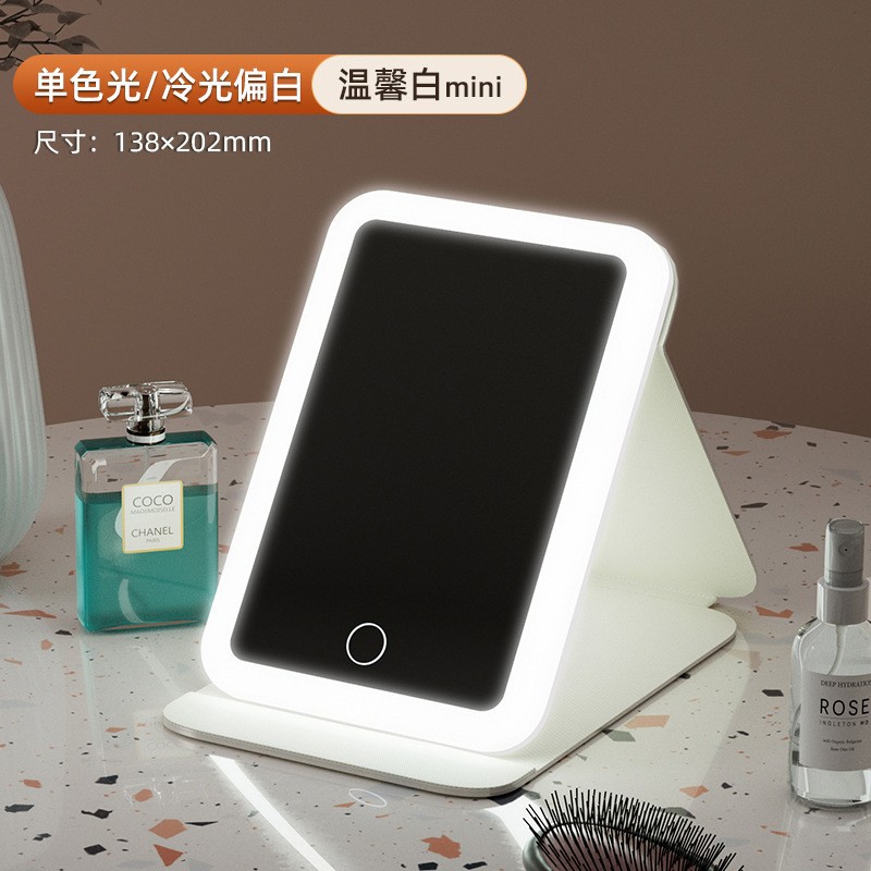 Espejo de maquillaje LED espejo de belleza plegable espejo de maquillaje de escritorio carga con luz de tres colores espejo de relleno de luz entrega al por mayor