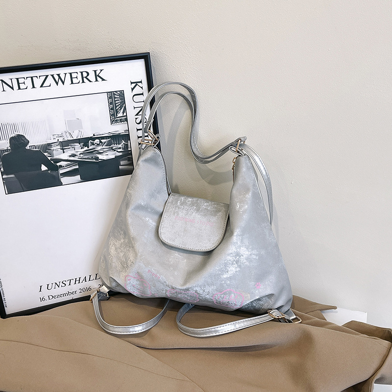 Bolso de mujer de tres usos 2025 nuevo encantador nicho de estilo extranjero mochila de hombro casual textura simple mochila de empalme