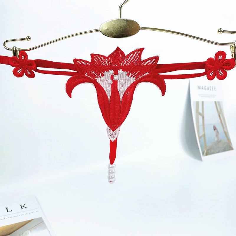 Sexy Hot sexy underwear women's hollow flower pearl massage low waist elastic temptation a rope T pants