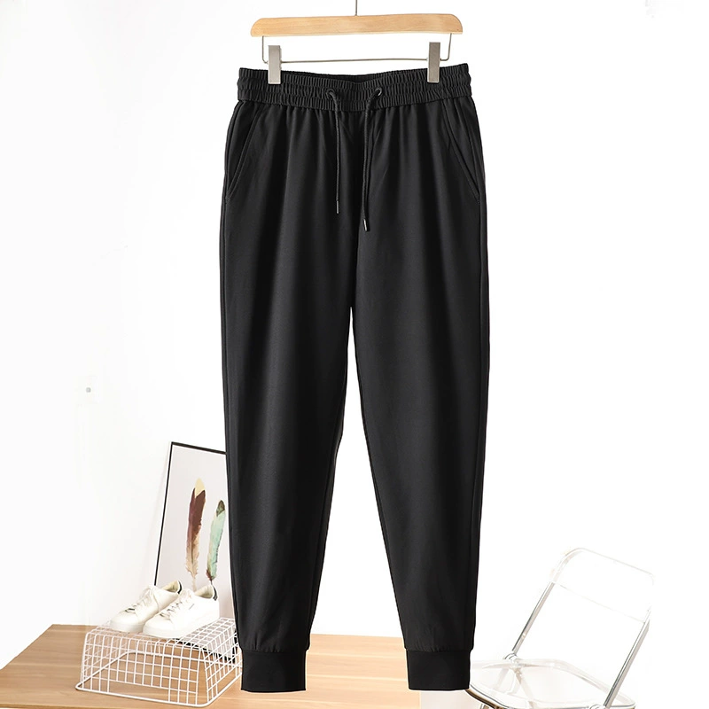 Пара зимних 90-х зимних новых мужских повседневных уличных водонепроницаемых брюк на гусином пуху с эластичной резинкой на талии.