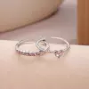 Two silver pink diamond love models