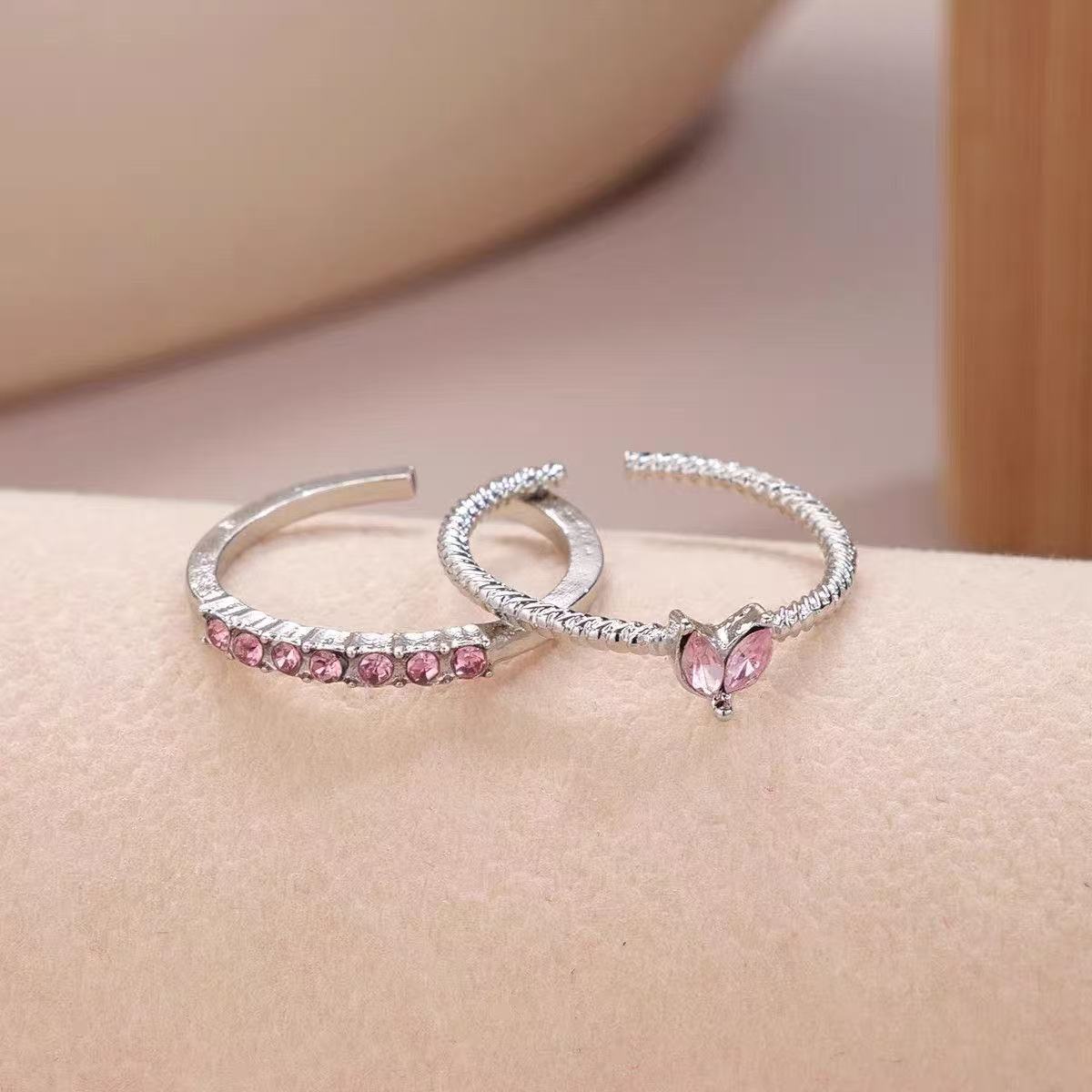 Two silver pink diamond love models