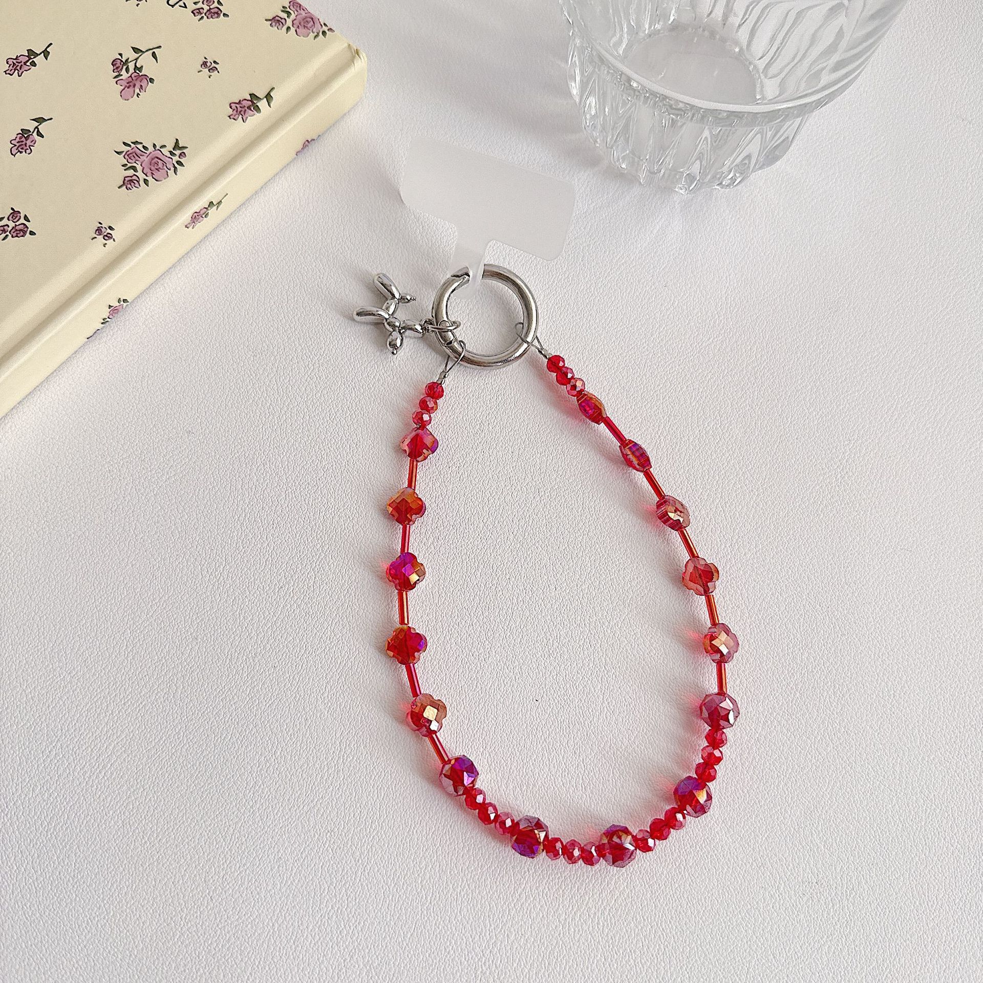 Boutique hecho a mano de alta gama para teléfono móvil cadena de muñeca de trébol de cuatro hojas de cristal original cadena de teléfono móvil de moda cuerda corta