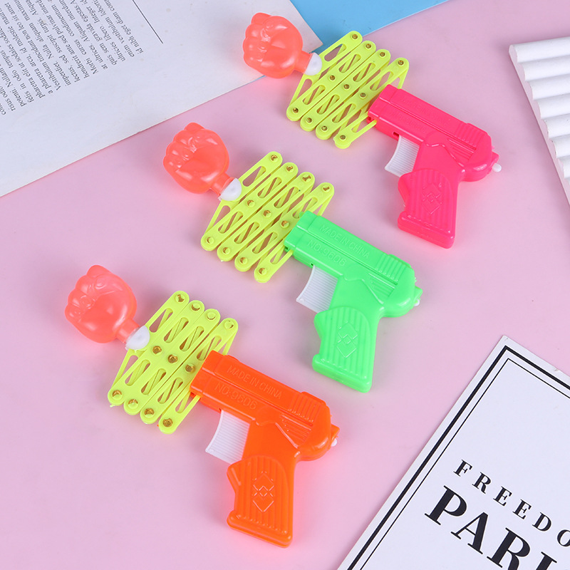 Magia de puño retráctil pistola elástica de resorte juguetes para niños después de los 80 nostálgicos y divertidos juguetes pequeños al por mayor
