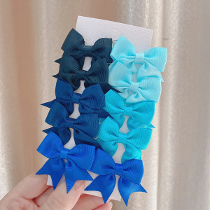 Juego de horquillas con lazo de cola de milano para niños de estilo caliente de Amazon, lindo y versátil, horquilla diaria para niñas europeas y americanas 323