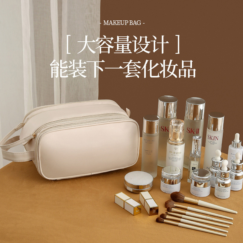 2025 nueva bolsa de maquillaje portátil de almacenamiento de gran capacidad de viaje de mujeres bolsa de lavado de lavado cepillo de maquillaje bolsa de escritorio