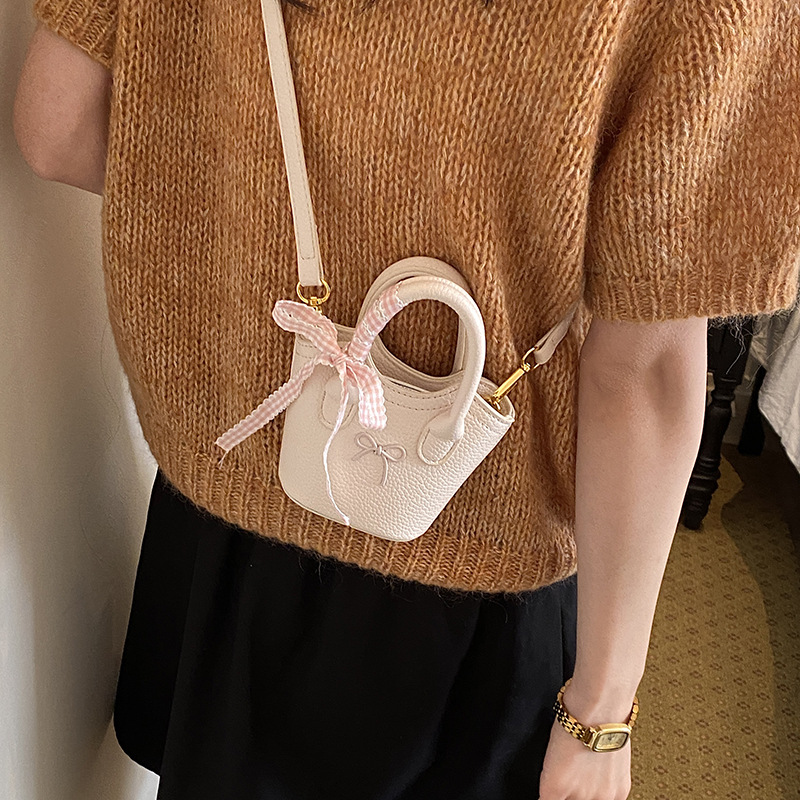 Nuevo bolso para niños coreano simple color sólido bolso de cubo para niños y niñas lindos arco mini bolso de mano bebé
