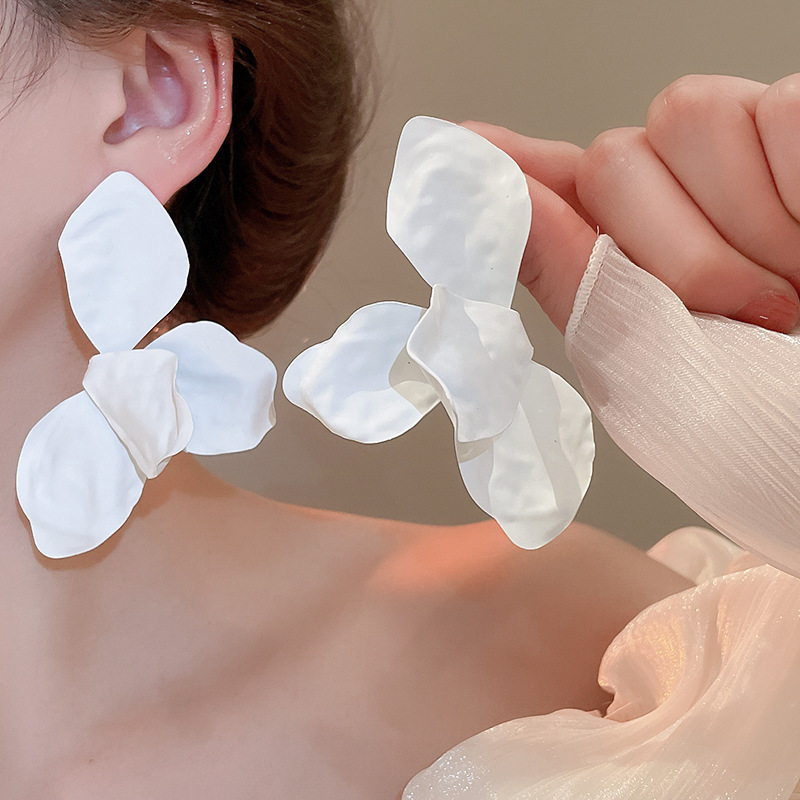 Pendientes de flor de lazo elegante de súper hada de plata Pendientes de moda de lujo ligero francés Pendientes de todo fósforo dulce de estilo literario