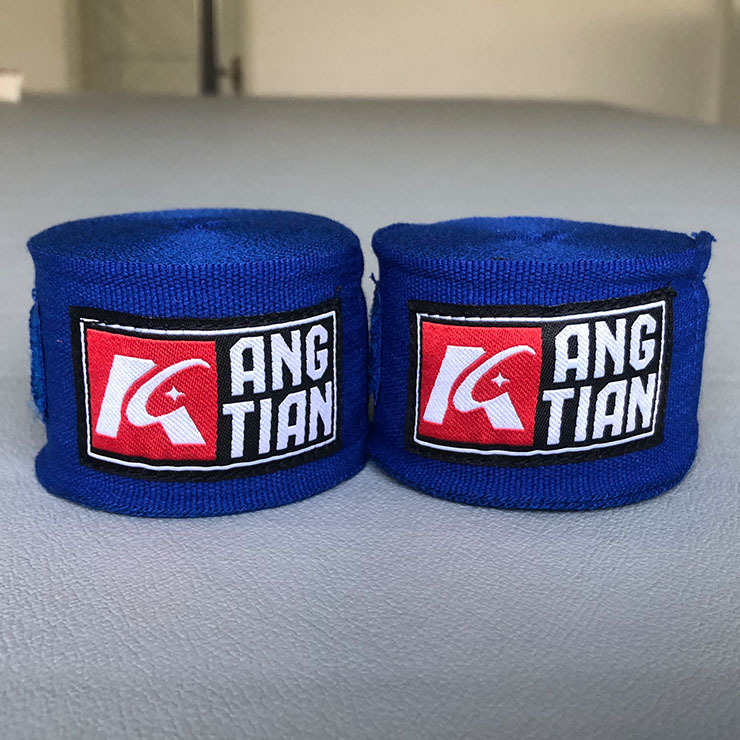 Fábrica Angtian venta directa de vendaje de boxeo guantes de brazo envueltos de mano correa de ataduras taekwondo Sanda protector de mano tela de lucha