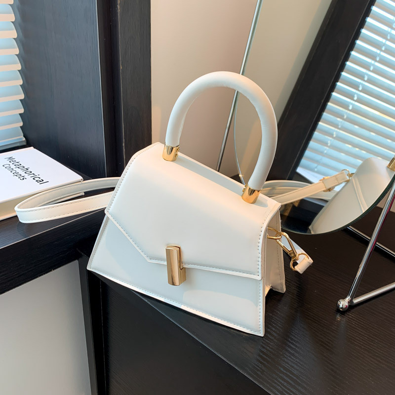 2023pu bolsa de mensajero estilo occidental simple bolso de hombro de las mujeres Bolsa de diseño de nicho portátil de moda con textura