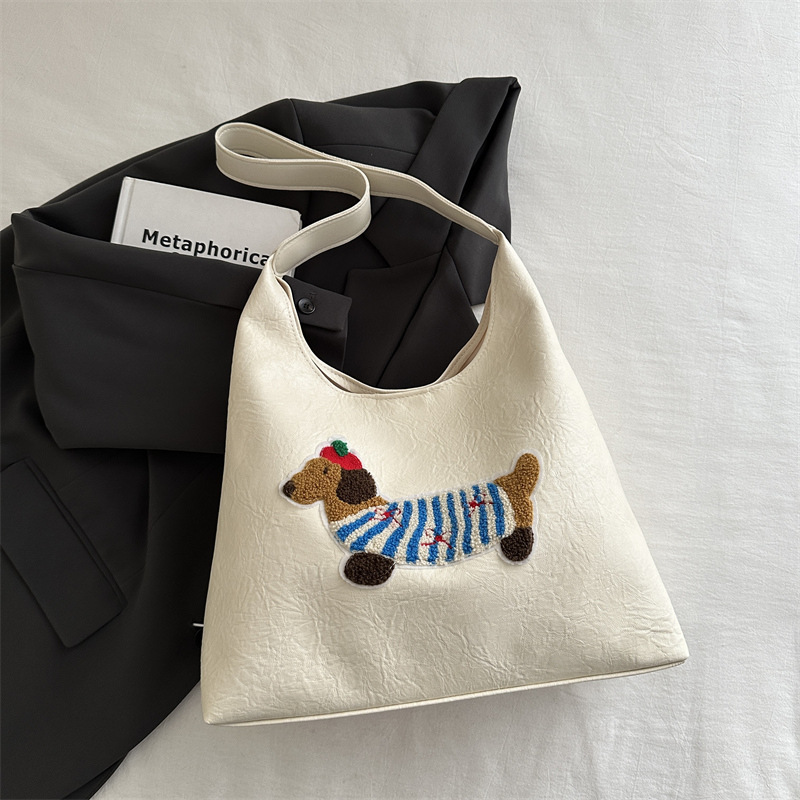 Simple y de alto valor exterior de moda bajo la axila 2024, otoño y invierno nuevo estilo coreano de gran capacidad de bolso de hombro de dibujos animados