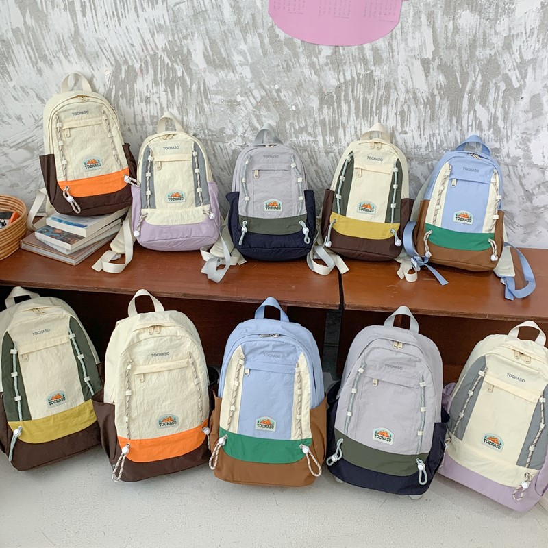 Mochila de moda coreana para niños y niñas, mochila de alta capacidad para estudiantes de escuela primaria, nueva mochila para niños con cuerda extranjera.