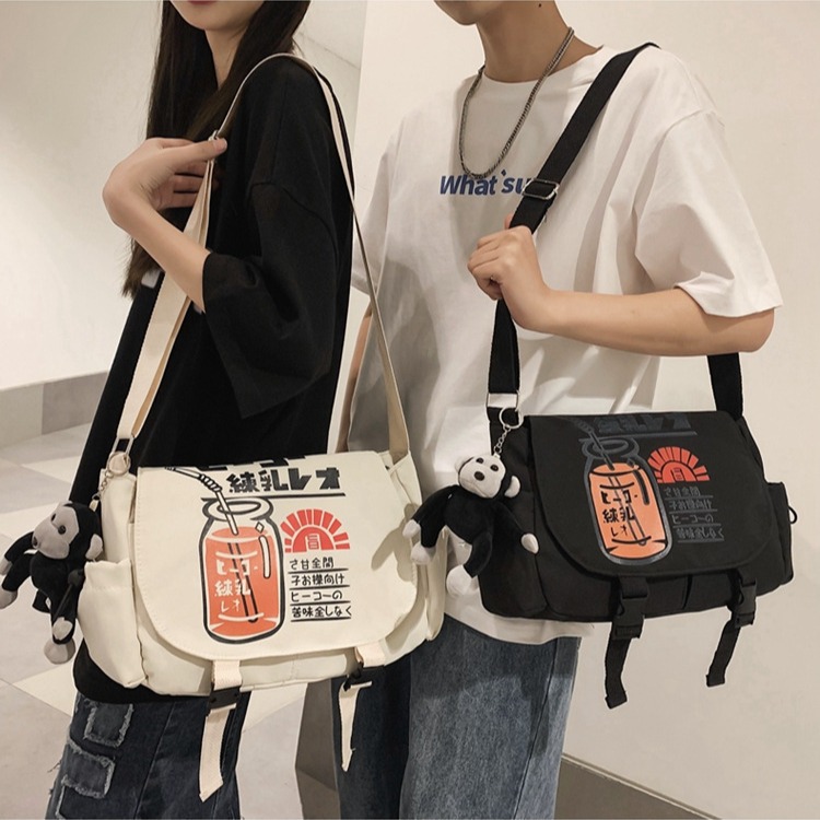 Nuevo bolso de las mujeres bolso de mensajero de los hombres y de las mujeres bolso de tela de un solo hombro japonés de moda Harajuku estilo de moda impreso bolso de mensajero de un solo hombro