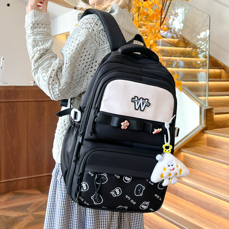 Nueva mochila de hombro simple letras negras con lindos colgantes mochila de carga mochila de gran capacidad