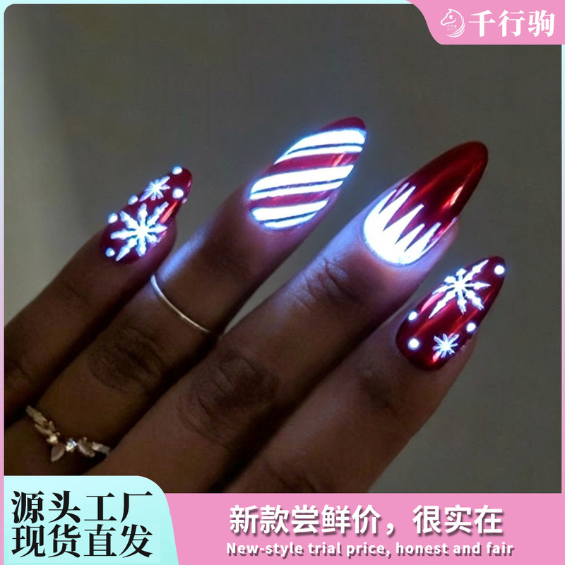 Christmas manicure nail tips, wearable nails with red base and luminous snowflake stripes, sweet and cool retro long almond-shaped fake nail patches