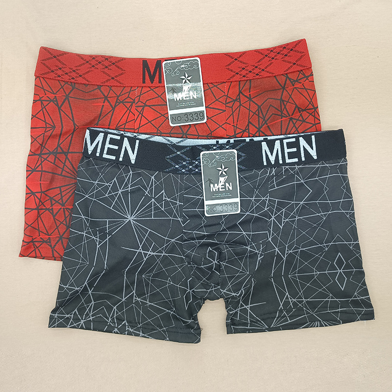 Pantalones de boxeador para hombres europeos y americanos Impresión de seda de leche tamaño libre pantalones de cuatro lados para hombres puestos de bajo precio transfronterizos especiales