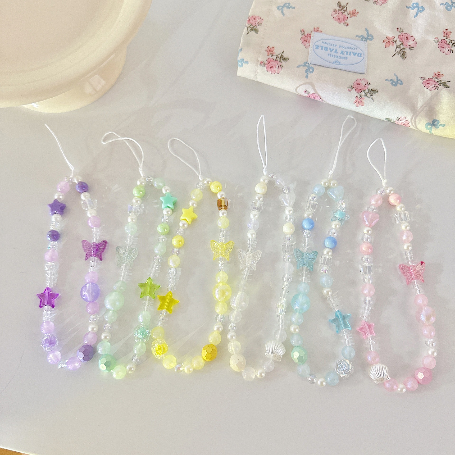 Cadena aplicable nicho mariposa corta cadena de muñeca arco cuentas de caso de teléfono móvil colgante tipo correa de muñeca anti-pérdida