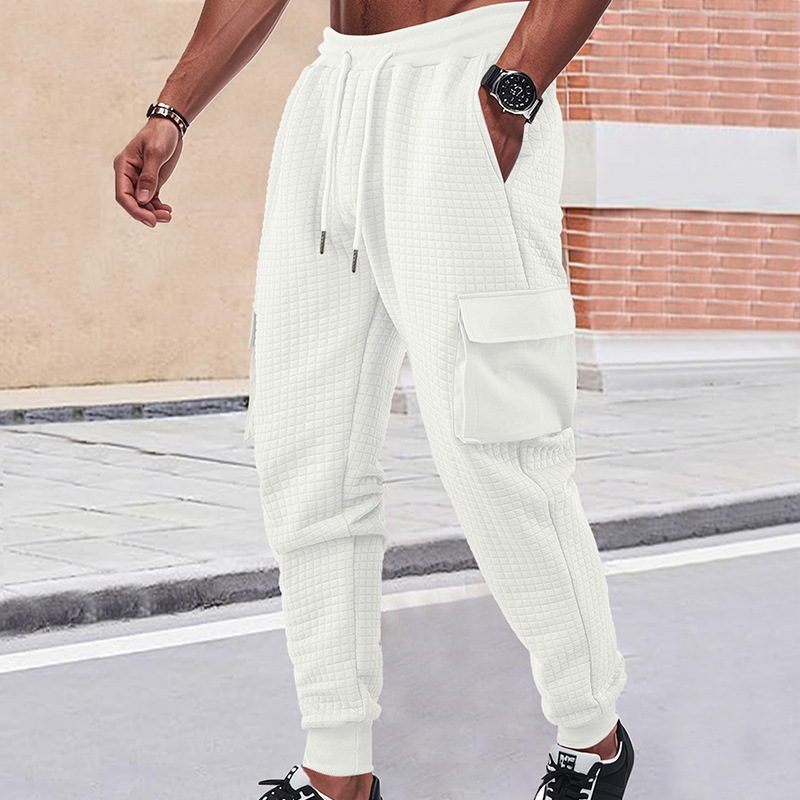 Nuevos pantalones deportivos de hombre de otoño transfronterizos europeos y estadounidenses gruesos pequeños cuadrados herramientas deportivas casuales pantalones de pila
