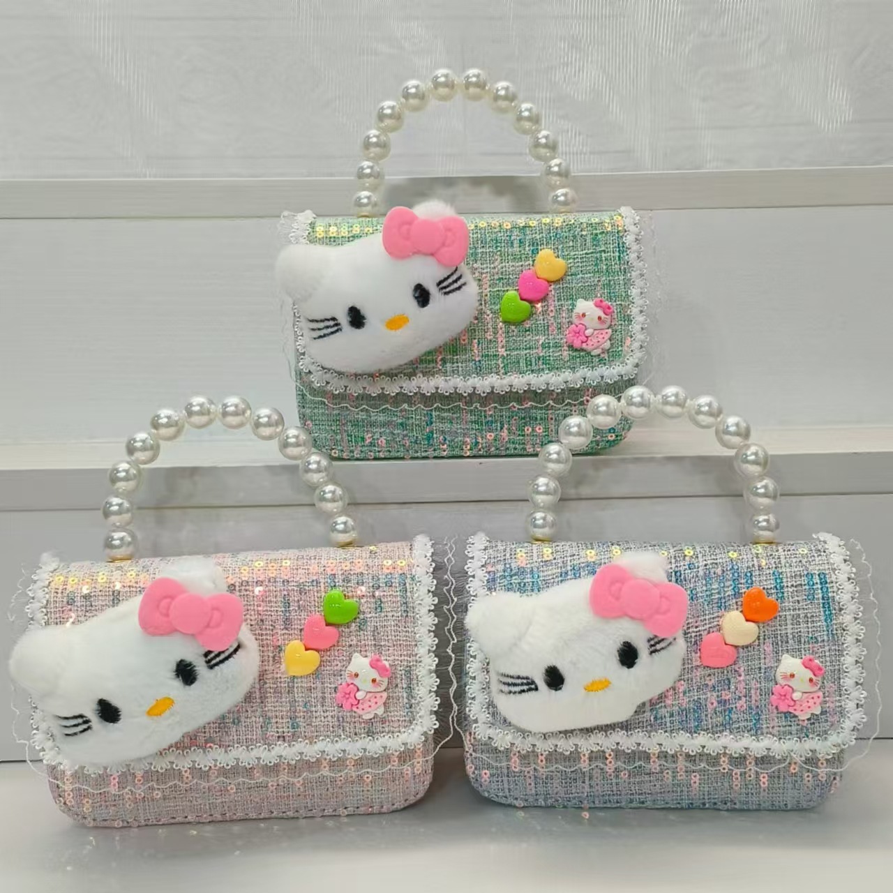 Bolsa de perla de dibujos animados de un hombro con una pequeña bolsa de cambio de viento bolsa de accesorios de niños bolsos cuadrados cadenas mochila de chicas