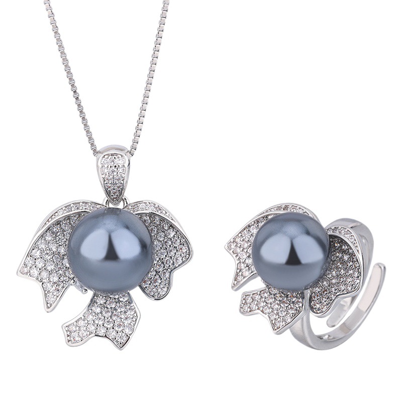 2023 Nueva Zhuang Sheng joyas de cobre de fondo chapado en oro perla joyería de moda traje de 12mm