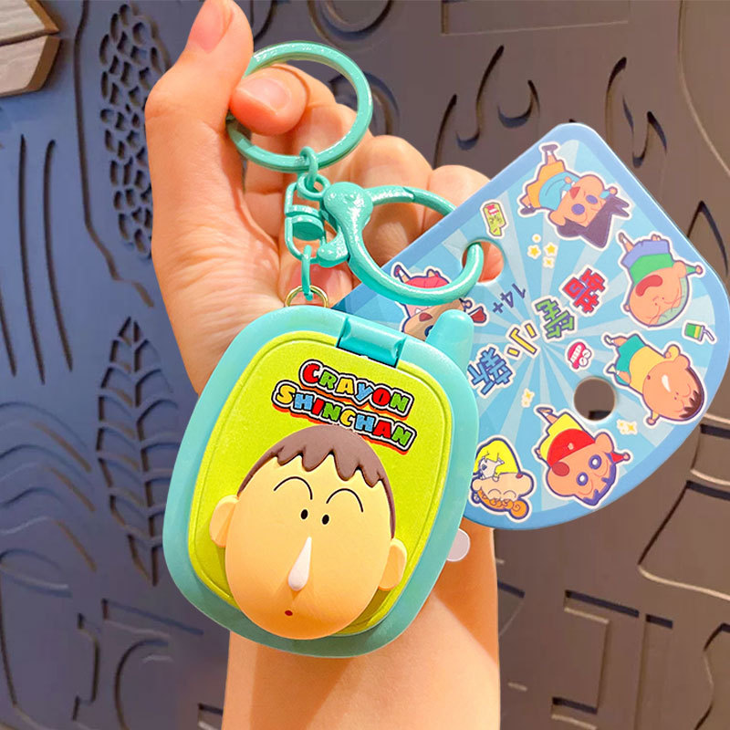 Crayons, mobile phone, game console, keychain
