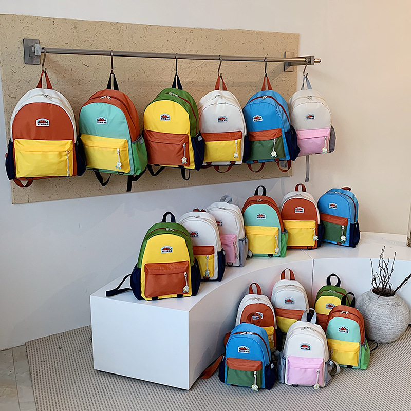Jardín de infantes para hombres y mujeres, mochila de color extranjero, mochila de estudiantes de primaria de gran capacidad, 2026 nueva mochila infantil transfronteriza