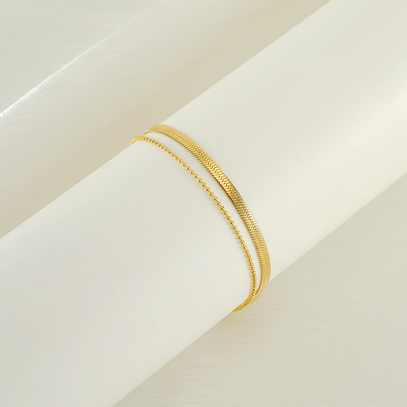 Moda europea y americana estilo francés nuevo tobillera de acero de titanio para mujer chapado en oro de 18 quilates cadena de tobillera de acero de titanio fabricante spot al por mayor