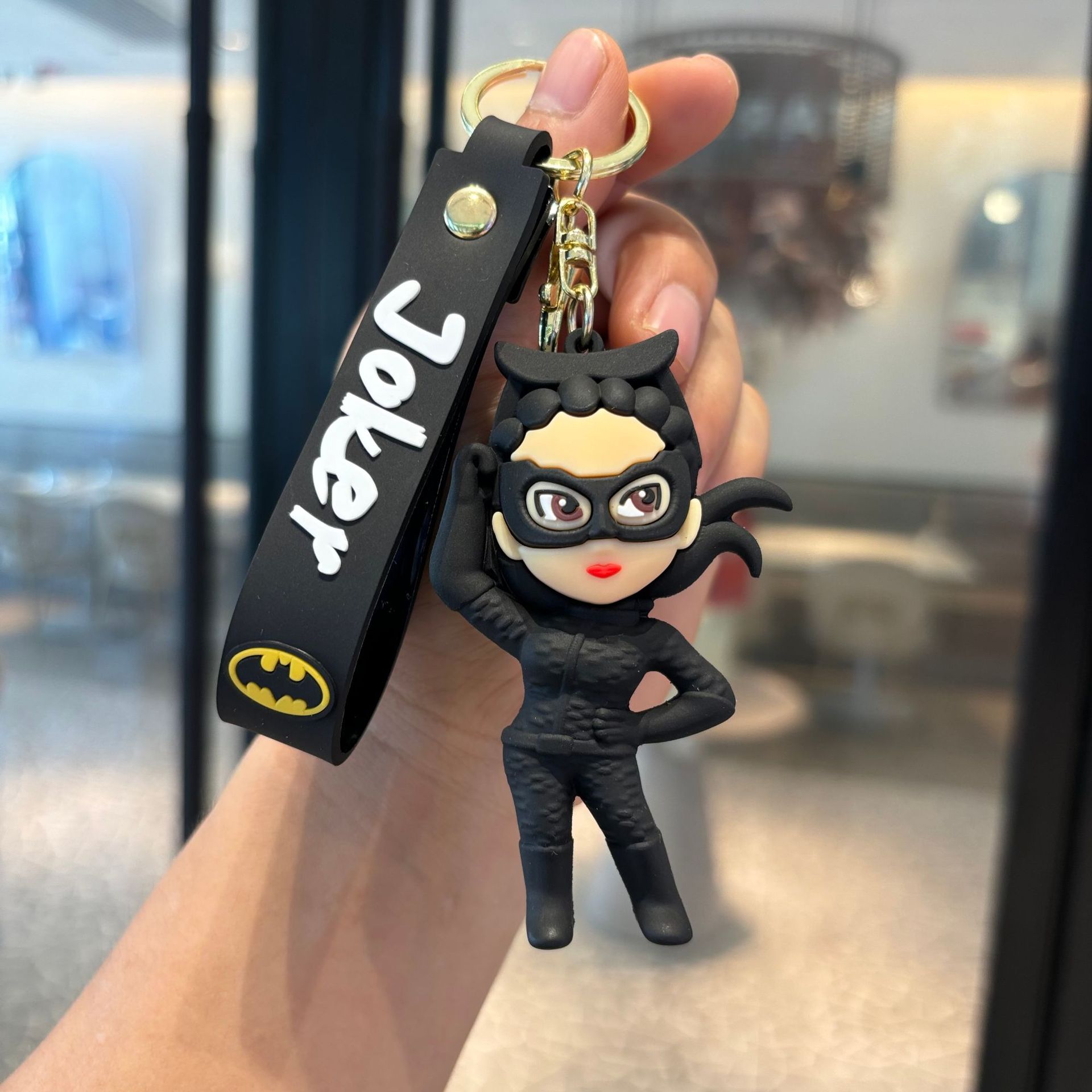 Batman cruzado superhéroes clown muñeca coche llavero colgante muñeca máquina de regalo pequeño