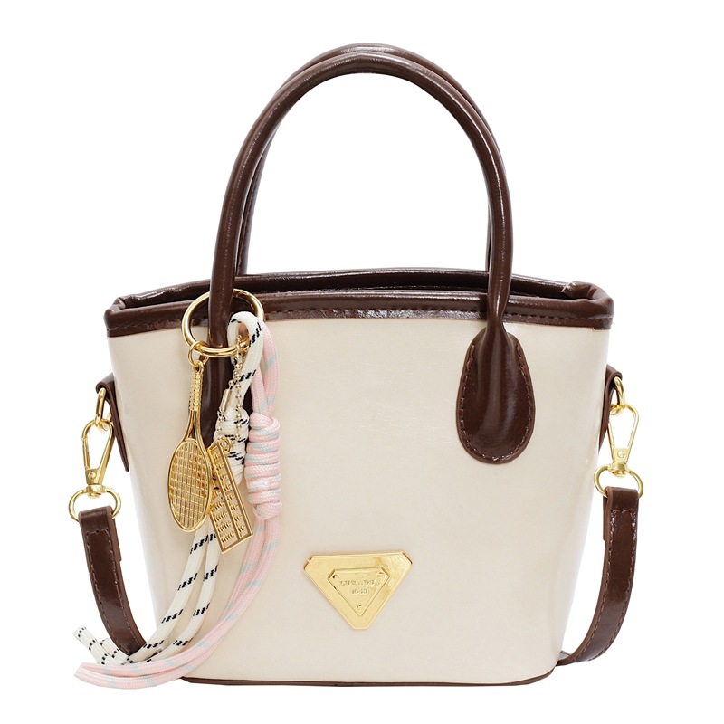 Bolso de mano de moda versátil para mujeres 2025 nuevo color de contraste de moda de un solo hombro bolso de cubo de alta sensación de mochila casual