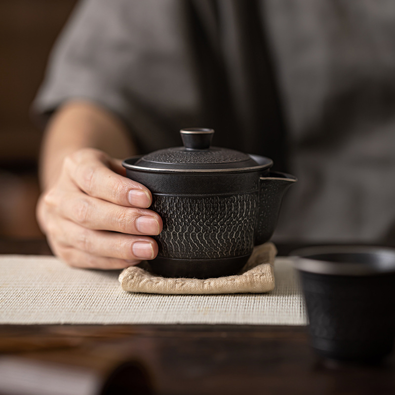 Ancient black silver hand-held pot stoneware teapot handmade jumping knife tea maker ceramic tea set household Chinese retro single pot Ancient black silver hand-held pot stoneware teapot handmade jumping knife tea maker ceramic tea set household Chinese retro single pot