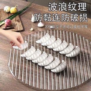The covered curtain of dumplings in the kitchen, steamed buns, noodles, dumpling tray, household pot, racket, plate, grate, dish preparation tray